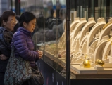 Two women look at Jewellery in a shopping area, 2012